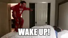 Woman jumping on bed yelling wake up