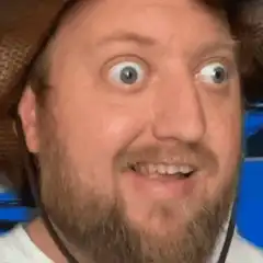 Man with wide eyes and straw hat