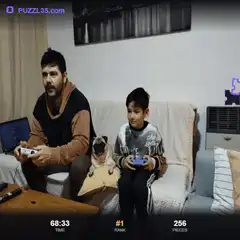 Man and boy playing puzzle game with pug