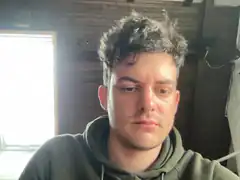 Man with messy hair looking down
