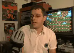 man playing video game with data glove