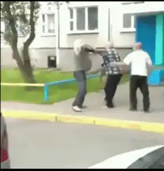 Old man gets tackled into a building