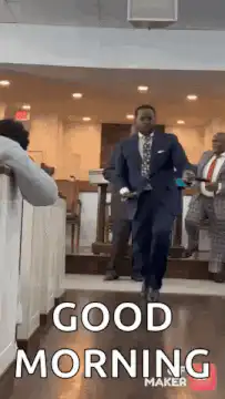 Man in suit dancing and waving