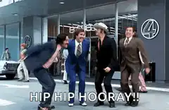 Four men jumping and shouting hip hip hooray