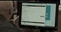 Man uses mouse to draw on computer screen