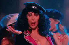Cher singing with backup dancers