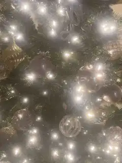 Close-up of Christmas tree lights and ornaments