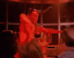 Red devil dancing in a club