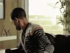 Man eating popcorn while watching TV
