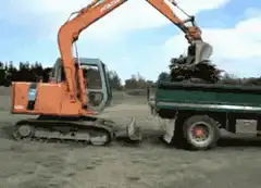 excavator jumps onto truck