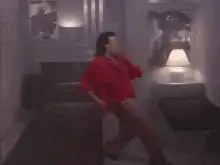 Man in red shirt floating upside down