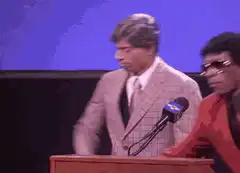 Bill Clinton dancing at podium