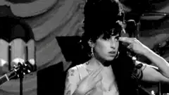Debbie Harry salutes and smokes