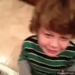 Crying toddler turns to smile