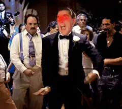 Man in tuxedo dancing with glowing red eyes