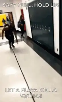 Man slides into a woman in hallway