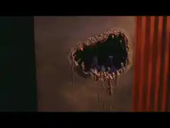 Alien breaking through wall