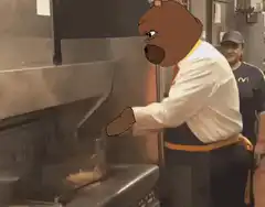 Bear head on McDonald's worker flipping burger
