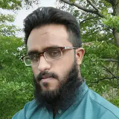 Man with beard and glasses outdoors