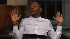 Marlon Wayans shrugging with hands up