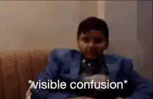 Boy in blue suit visible confusion