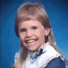 Blonde girl smiling and laughing