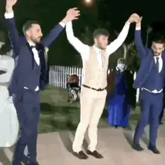 Men in suits dancing at night