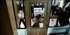 Man walks through door with tray