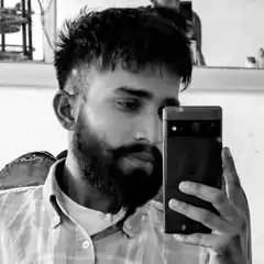 bearded man taking mirror selfie