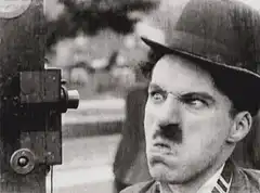 Charlie Chaplin squinting at camera
