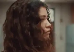 Woman with curly hair looking skeptical