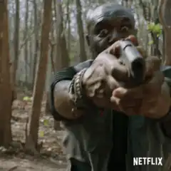 Morgan Jones points gun with wide eyes