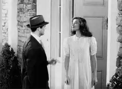 Man slaps woman and pushes her through door