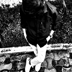 man in black shirt and white pants