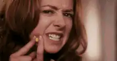 Woman throws pimple at mirror