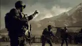 Soldier commands troops in dusty field