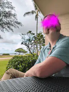 man with glowing pink eyes