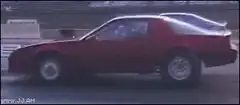 Red car rear tire explodes