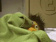 Telly Monster hiding under blanket