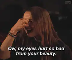 Woman rubbing eyes from beauty