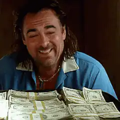 Joey Tribbiani laughing with money