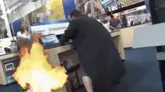 Man hacking laptops in store