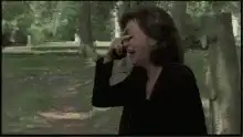 Woman laughing hysterically on phone