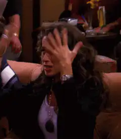 Phoebe throwing her hands up in frustration
