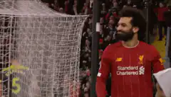 Mohamed Salah smiles near goal