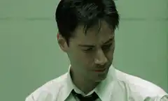 Neo gives the finger in The Matrix