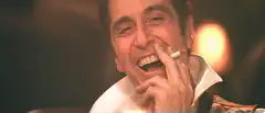 Al Pacino laughing with cigarette