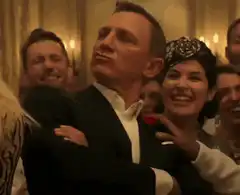 James Bond smirks at party