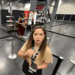 woman reaching hand toward camera