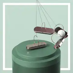 Newton's cradle with pink ball